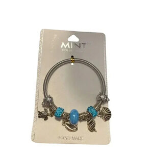 SILVERTONE CHARM STRETCHABLE BRACELET TURTLES AND SEA SHELLS